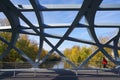 Hans Wilsdorf Bridge or Birds`s nest bridge over the Arve River in Geneva. Royalty Free Stock Photo